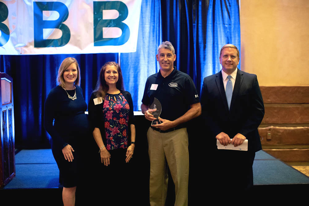 HIGH STANDARDS
The Better Business Bureau in the Springfield region honored six businesses with Torch awards during a Sept. 25 luncheon at White River Conference Center. Pictured, left to right, is Stephanie Garland, the BBB’s Springfield regional director; Megan and Chip Broemmer of award winner Advanced Car Care Center LLC in Strafford; and event emcee David Oliver of KOLR-TV. Other businesses recognized for exceptional service and ethics were technology infrastructure firm CKC Data Solutions LLC; auto repair shop Complete Automotive; motorcycle dealership Denney’s Harley-Davidson of Springfield; Nixa architecture firm Insight Design Architects LLC; and remodeling contractor Top Tier Kitchens & Baths.